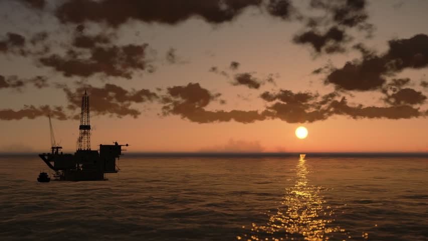 Oil Rig in Ocean, time lapse clouds at sunset, helicopter view