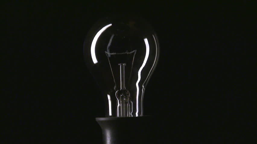 Real Light Bulb Turning On Flickering And Turning Off On Black