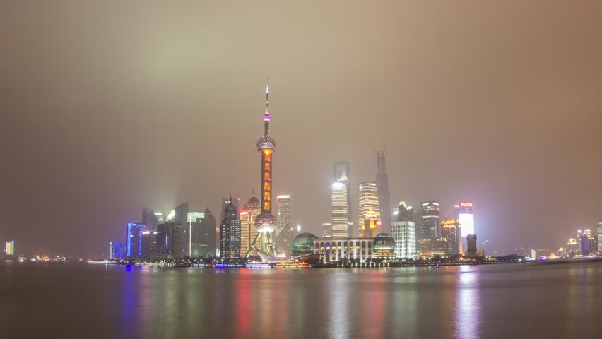 SHANGHAI - CIRCA 2013: Time Lapse of river traffic by Pudong, Shanghai, China from Day to Night. Photo Sequence from DSLR camera and Post production in After Effects