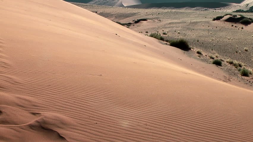 sand floating over big daddy dune at soussuvlei,namibia, africa
