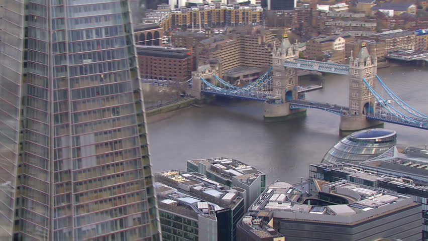 Aerial view of the iconic landmark that is Tower Bridge which crosses the River Thames in London. London's tallest building can also be seen.