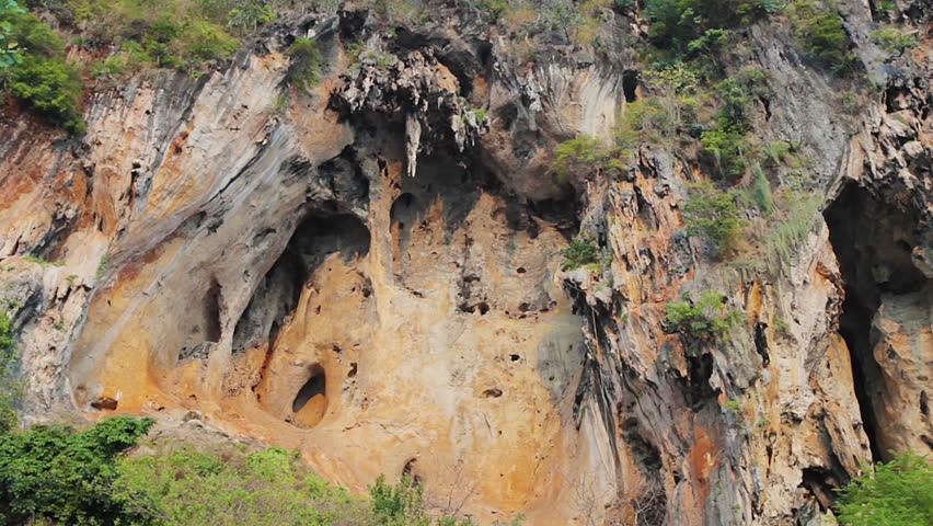 1920x1080 video - Panoramic view on high limestone rock with stalactites and caves