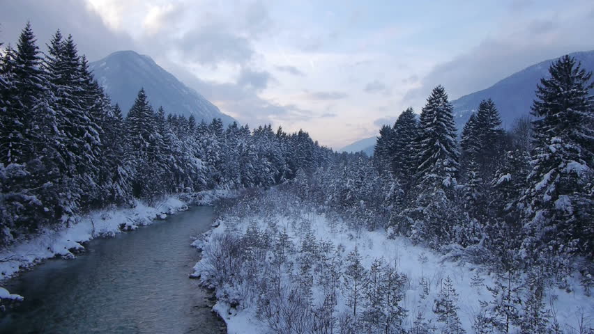 AERIAL: Flight over the river in winter