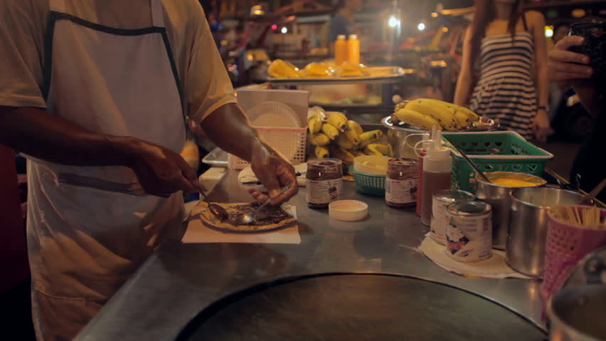 Food vendors on Khao San Road at night on 20 November 2012 in Bangkok, Thailand. Khao San road is the mekka for all tourists arriving in the capital.
