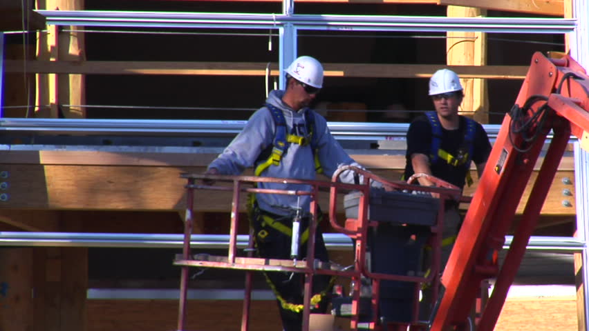 two men in cherry picker crane