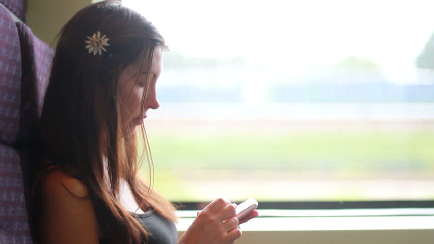 Young woman traveling by train