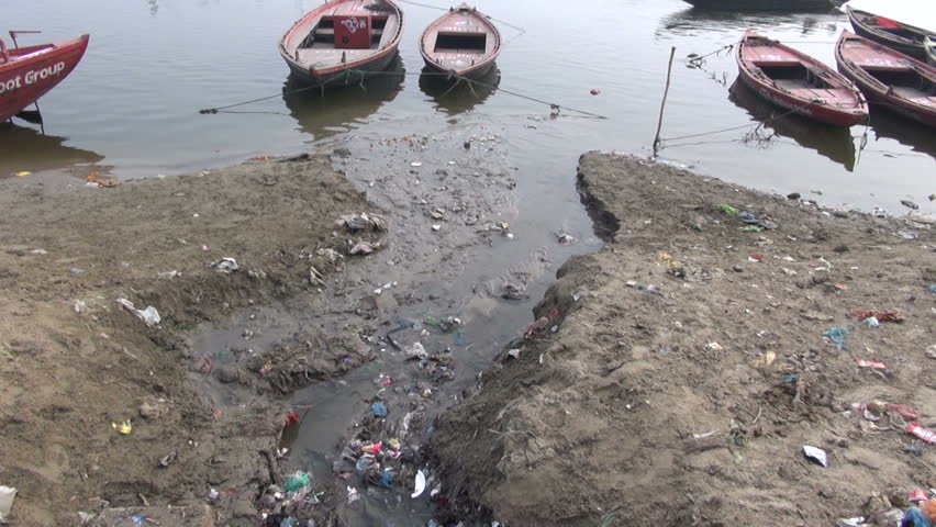 water pollution channel with rubbish near sacred Ganges river in Varanasi, India

