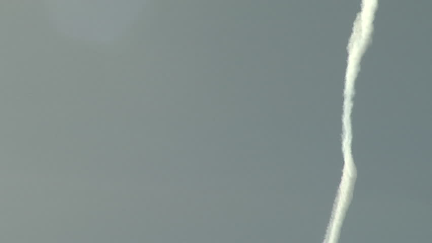 Contrail Contortions. Wind shear smears out a fresh jet contrail