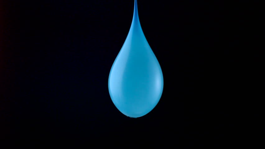 Popping water balloon on black background shooting with high speed camera, phantom flex.