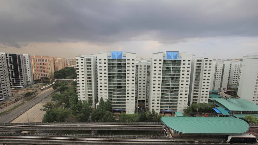 Punggol Estate Apartment Buildings wtih Road Traffic and Light Rail Public Transportation on a Cloudy Stormy Day in Singapore Timelapse 1920x1080
