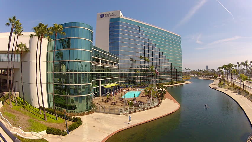 LONG BEACH, CA - APRIL 2, 2013: The Hyatt Regency Hotel lodges many tourists and convention goers at the Convention Center circa 2013 in Long Beach.  Adjacent to the hotel is Rainbow Lagoon Park.