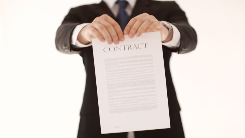 man in suit and tie breaking a contract
