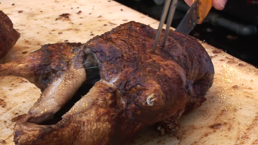 HD1080i Carving a Roasted Duck on Oktoberfest. Munich beer festival.