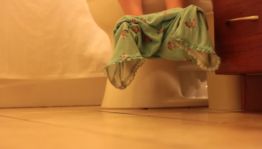 Little feet hanging from the potty.