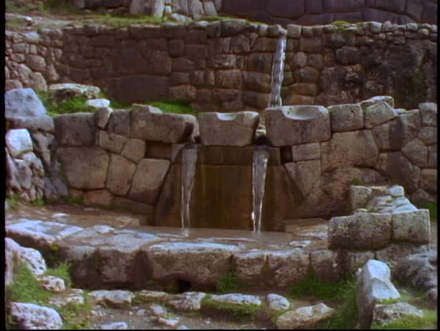 Peru, The Andes, Inca ruin detail, tilt up ceremonial water drains, close up