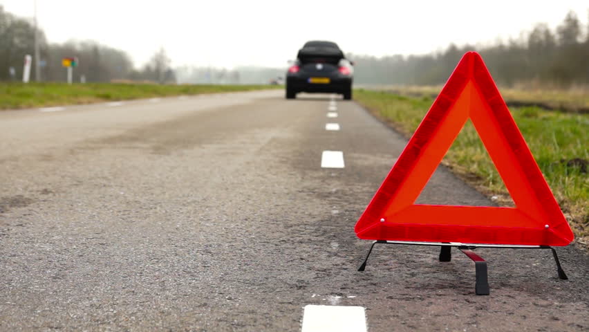 A car with a breakdown alongside the road
