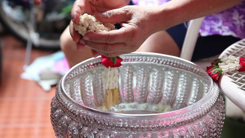 Thai people celebrate Songkran (new year / water festival: 13 April) by giving garlands and pouring water to their seniors and asked for blessings 