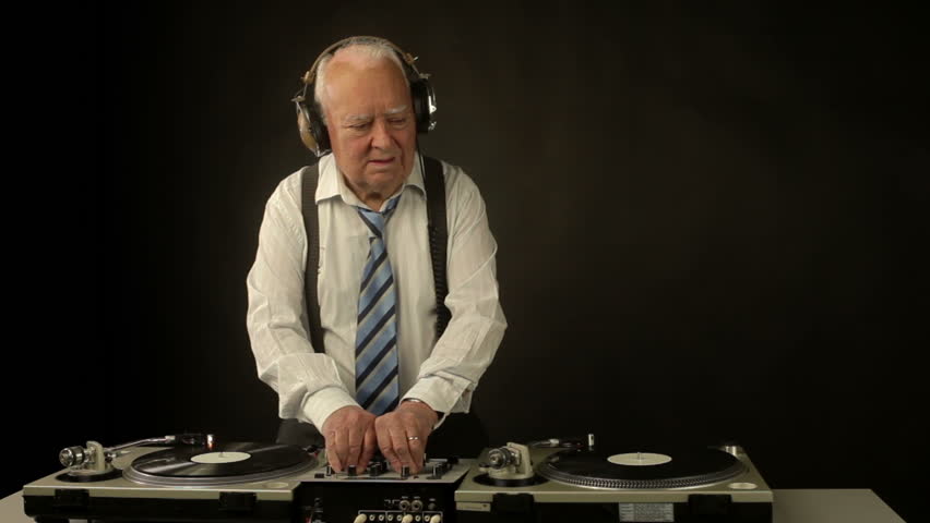 a very funky elderly grandpa dj mixing records
