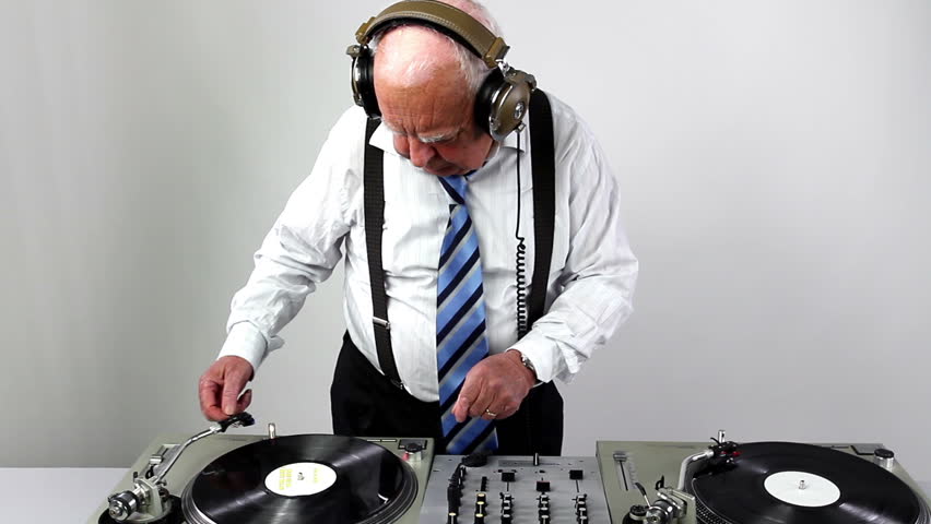 a very funky elderly grandpa dj mixing records
