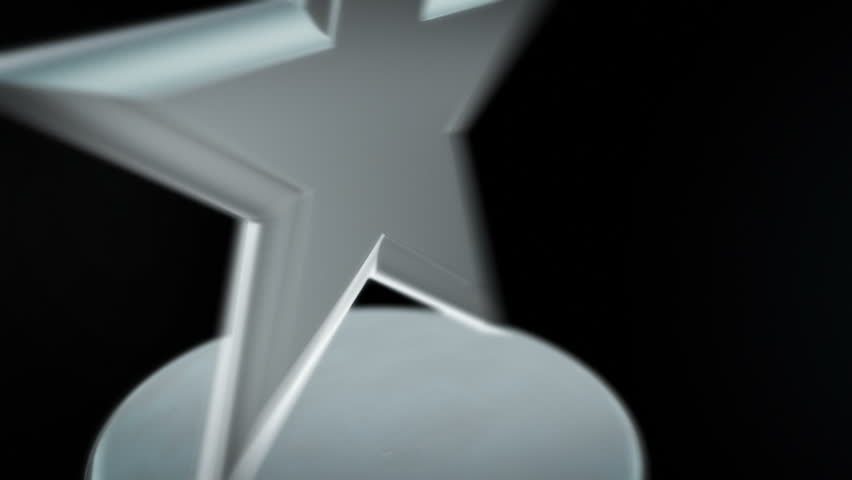 Silver Star Award - Spinning award statue in silver, ideal for any award ceremony. with copy space at the end to put your own text or logo.