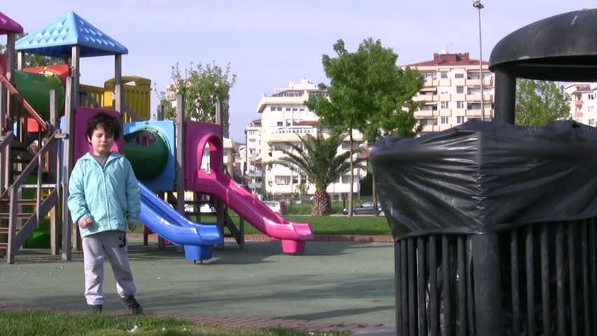 Little boy Picking Up Litter 