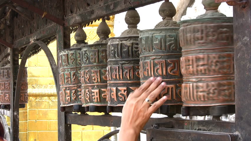 Spinning Buddhist prayer wheels in Nepal