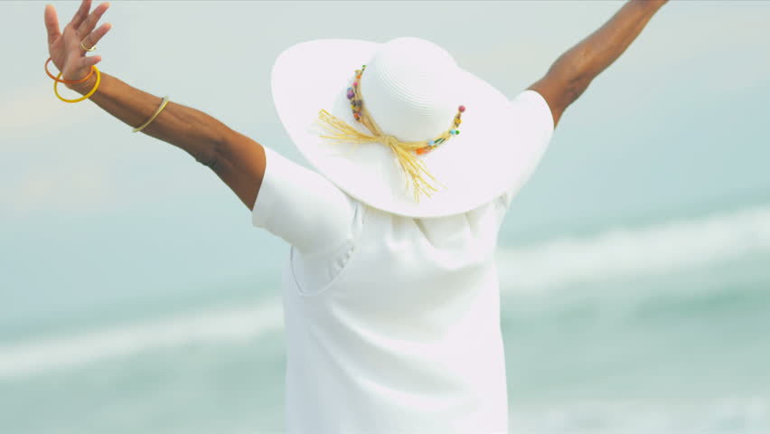 African American female reveling in her retirement beach lifestyle shot on RED EPIC