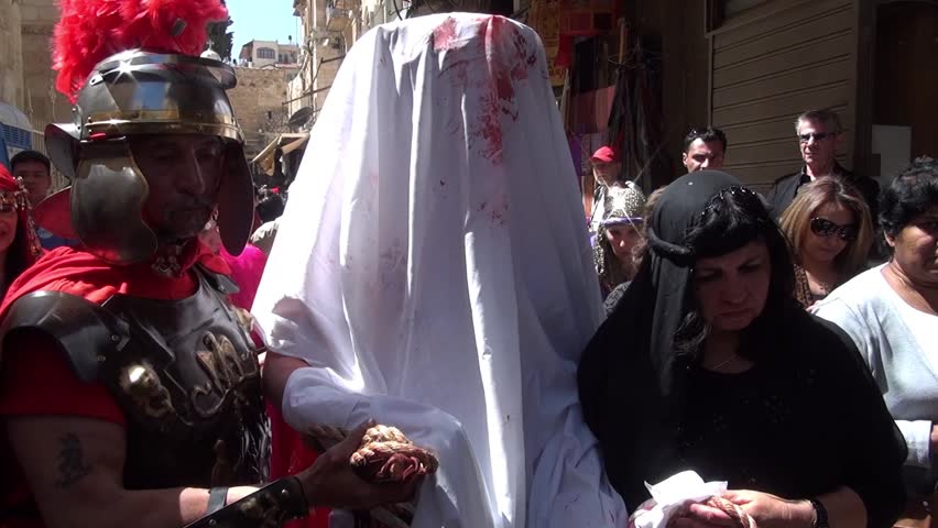 JERUSALEM-MARCH 29: Catholic Holy Friday - a group of actors depicting the crucifixion of Christ near Holy Sepulcher in Old City Jerusalem, Holy Friday March 29, 2013 in Jerusalem, Israel