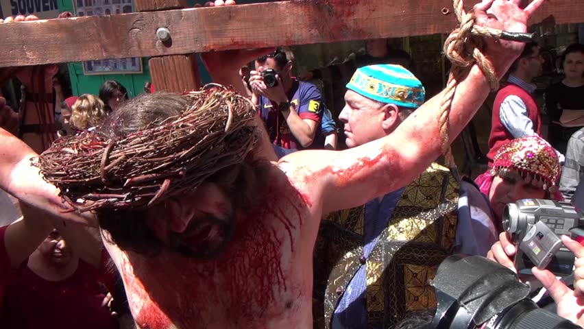 JERUSALEM-MARCH 29: Catholic Holy Friday - a group of actors depicting the crucifixion of Christ near Holy Sepulcher in Old City Jerusalem, Holy Friday March 29, 2013 in Jerusalem, Israel