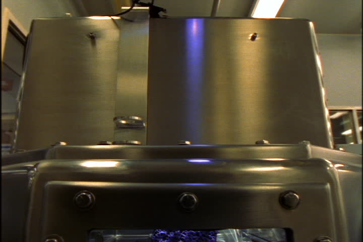 JOHNSON SPACE CENTER, HOUSTON, TEXAS - APRIL 28, 1999: Tilt down to moon rock inside glass and steel enclosure.