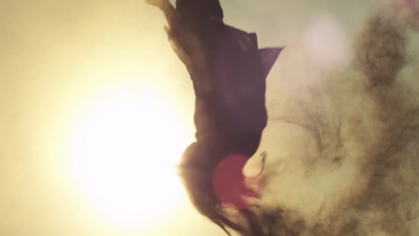 Pure Freedom, Man doing a silhouetted slow motion flip in the Sun, Shot on RED EPIC. 