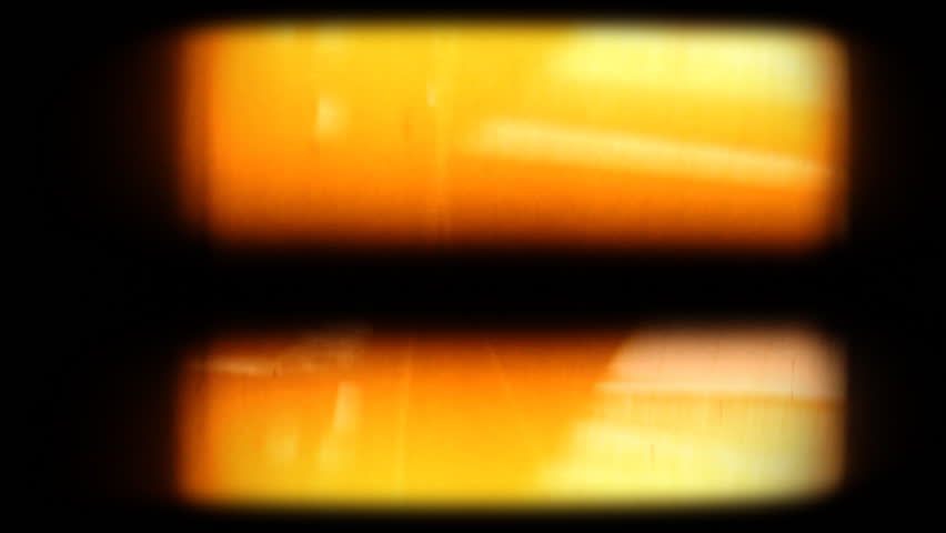 Blank 8mm film projected on screen with flicker. Composite this over your footage to get an old film look. Please see my large collection of film textures and effects for more clips like this.