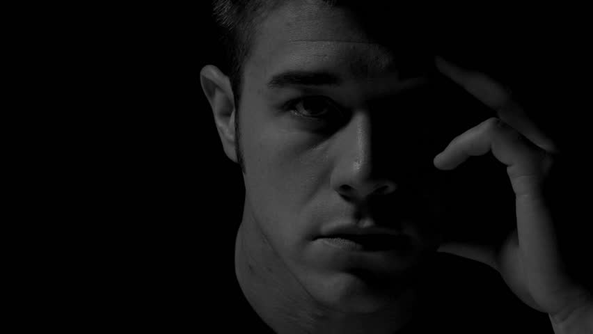 Man thinking in black and white. Experimental lighting. 