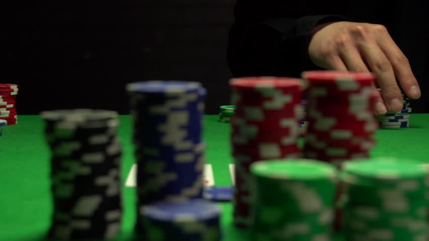 Man raises bet in Texas Hold 'em