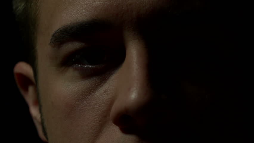 Close up of man's eyes in color. Experimental lighting.
