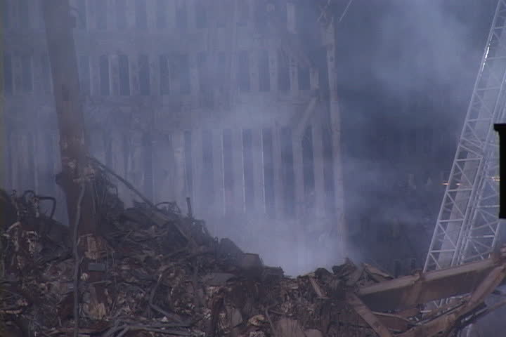 NEW YORK CITY - SEPTEMBER 28, 2001: Rising smoke and pile of rubble in front of remains of World Trade Center structure.
