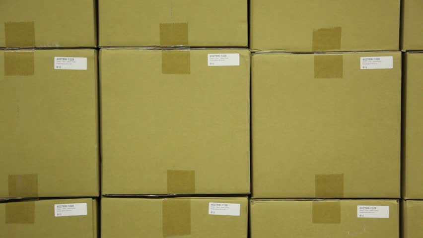Warehouse, placing a FRAGILE sticker.