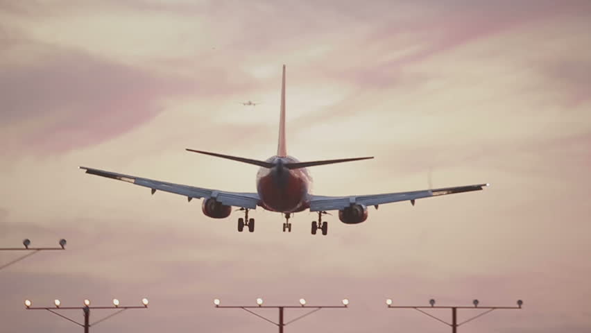 USA, Los Angeles - April 22: Landing Airplane at sunrise on April 22, 2013 in USA, Los Angeles.