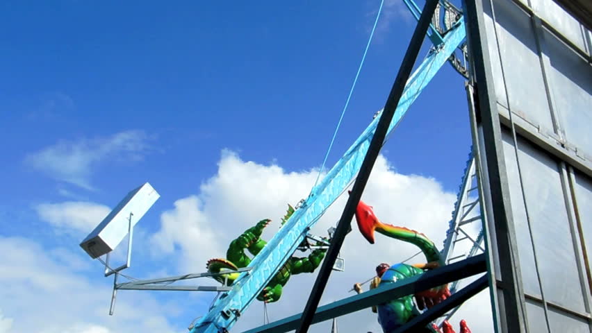Cologne - may 12, 2013 - Swinging dragon at funfair. Dragon ride at the yearly carnival in spring.