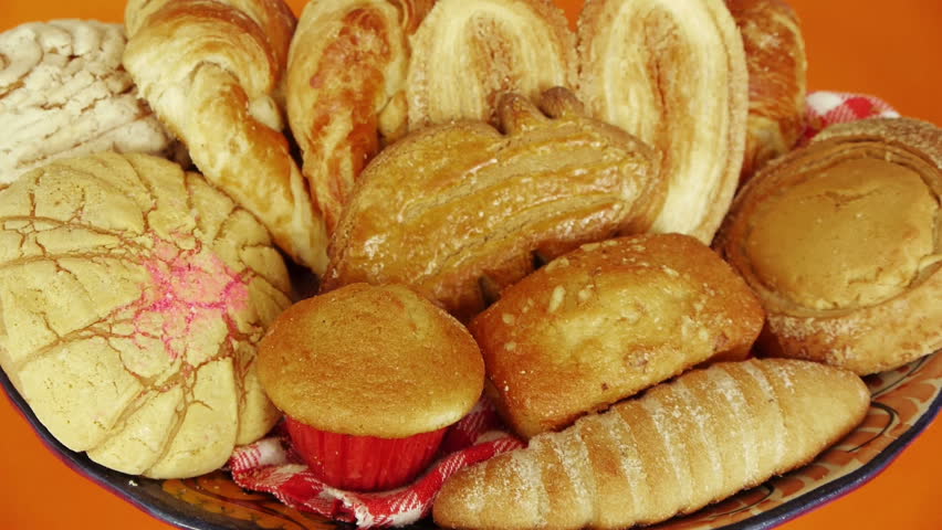 Grabbing Assorted Traditional Mexican Sweet Breads