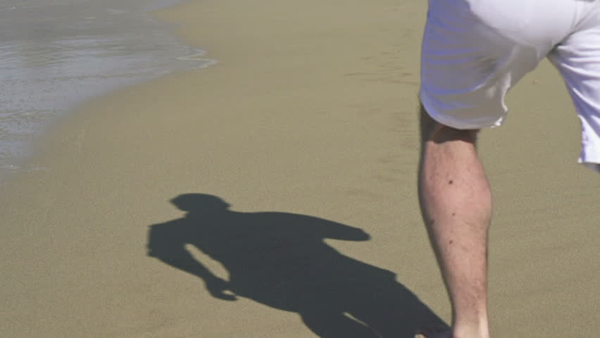 Man running on beautiful beach
