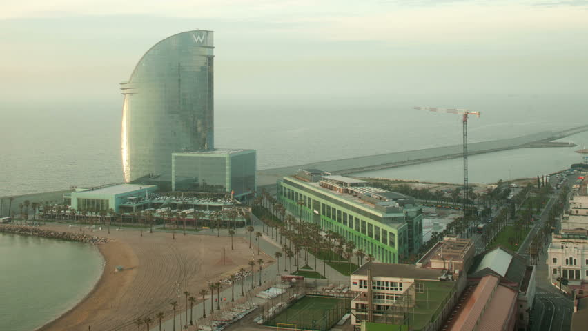 BARCELONA- MAY 12: Timelapse shot of the W hotel, a unique glass tower on the edge of the beach. 12 May 2013, Barcelona, Spain.