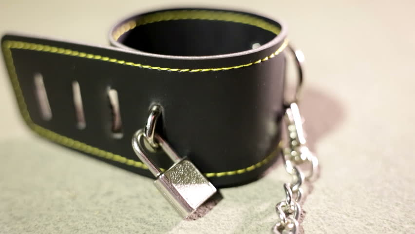 BDSM or dominance and submission for short bondage cuffs for restricting persons freedom, doing with it whatever the dominant partner wants. Quality leather cuffs with locks.
