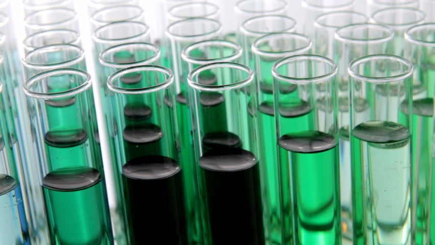 Close up HD video of rotating test tubes filled with biofuel