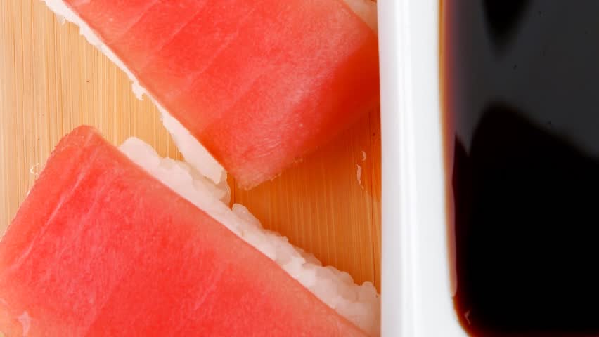 Nigiri Sushi - Set of Nigiri sushi topped with raw Tuna (maguro) . . on wooden board 1920x1080 intro motion slow hidef hd