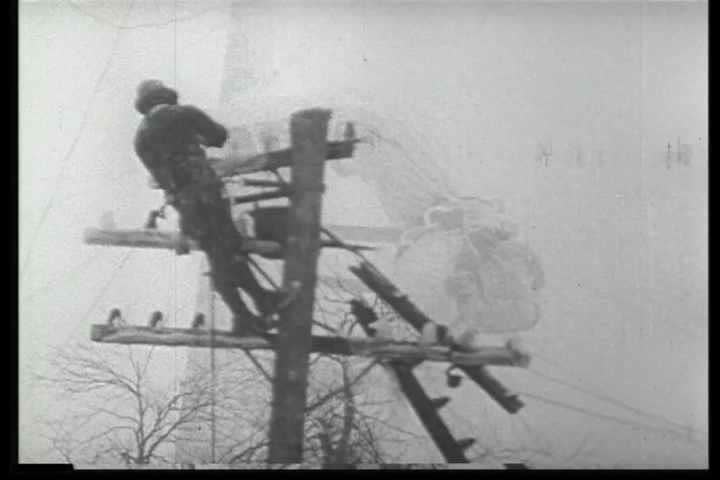 1940s - Archival black and white film highlights the efforts of telephone installers and line repairmen that keep the nation's telephone system running.