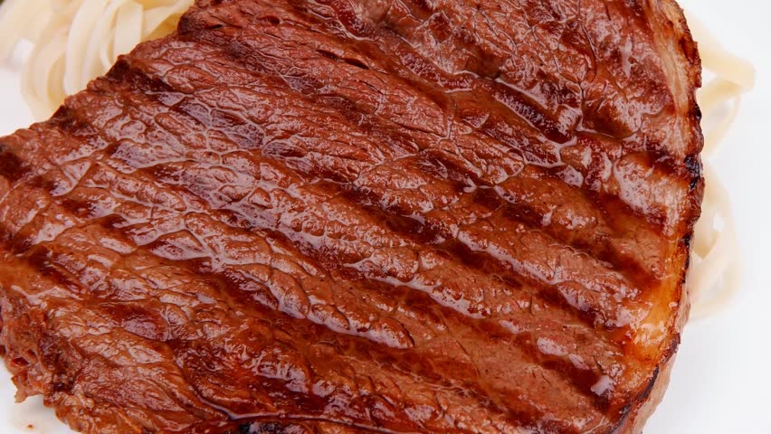 italian cuisine : grilled beef steak with pasta and tomatoes on basil leaf on plate 1920x1080 intro motion slow hidef hd