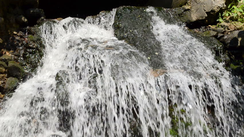 brook stream flow run through old retro stones cascade.