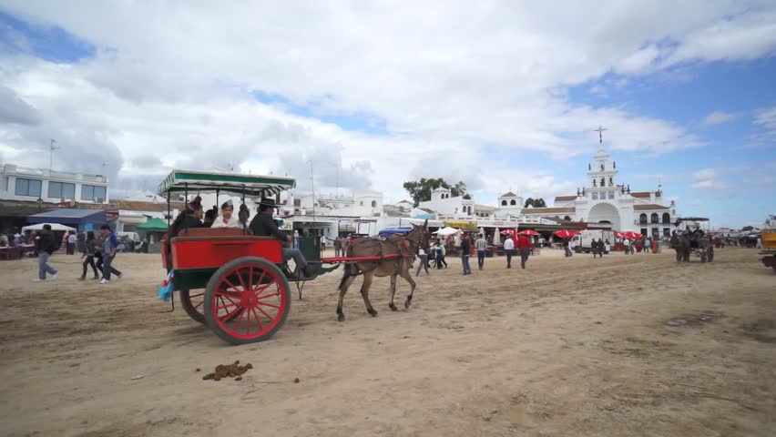 El ROCIO, ANDALUCIA, SPAIN - MAY 19: Pilgrims, people attend to the Sanctuario de Nuestra Senora de El Rocio in one of the most famous religious pilgrimage of Spain. May 19, 2013 in el Rocio, Spain