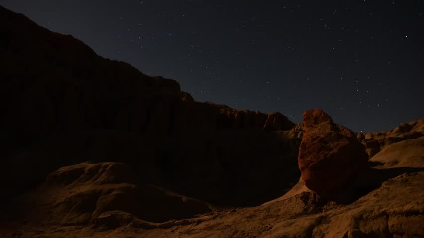 Astrophotography Time Lapse Moonshadow across Sandstone